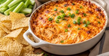 Baked Buffalo Chicken Dip for Game Day served fresh with the ingredients described in the recipe